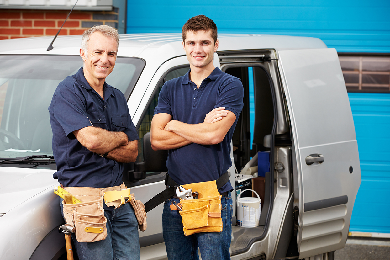 Workers In Family Business Standing Next To Van Abour Lifemark Bath & Home in Springfield, MO