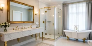 Luxury bathroom with marble double vanity, gold fixtures, glass shower, and freestanding bathtub