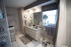 Modern bathroom remodel showing updated tub and shower with contemporary fixtures