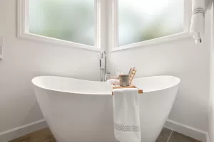 Modern bathroom featuring a freestanding bathtub, contemporary fixtures, and elegant finishes for bathroom remodeling in Republic, MO.