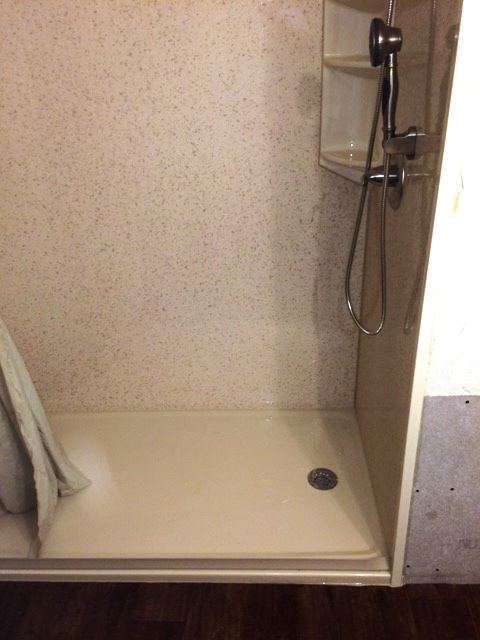 Walk-In Shower With Handheld Showerhead And Built-In Corner Shelves